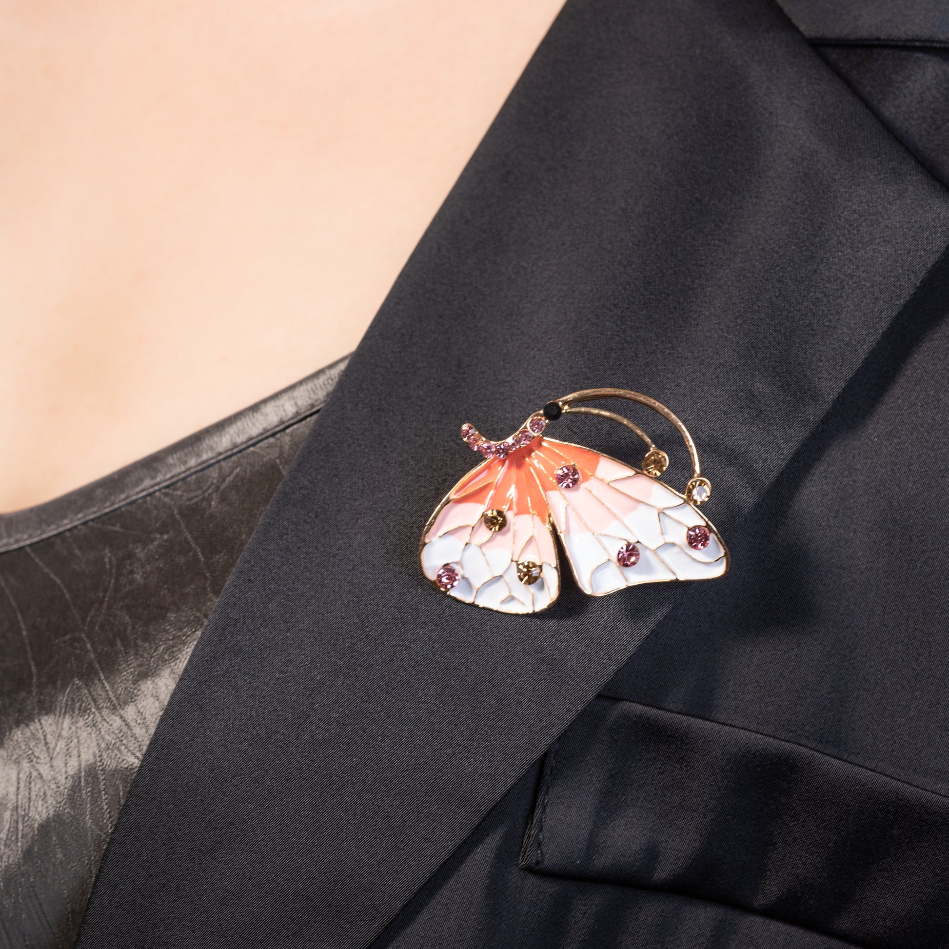 glossy colorful enamel wings on an antique-style butterfly pin