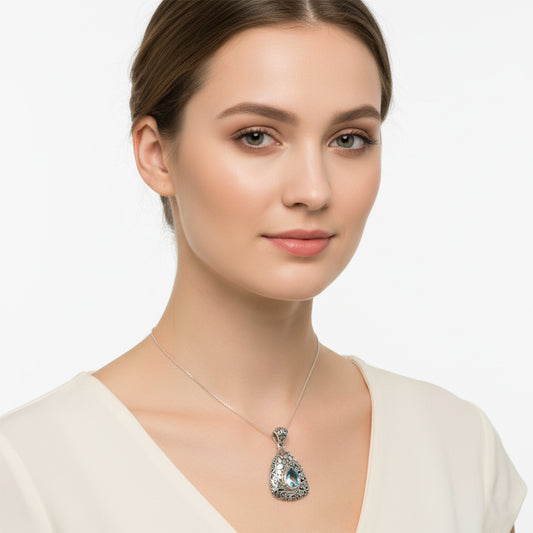 Woman wearing a necklace with a pendant 