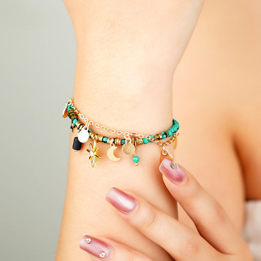 yellow gold plated celestial charm bracelet with blue turquoise beads