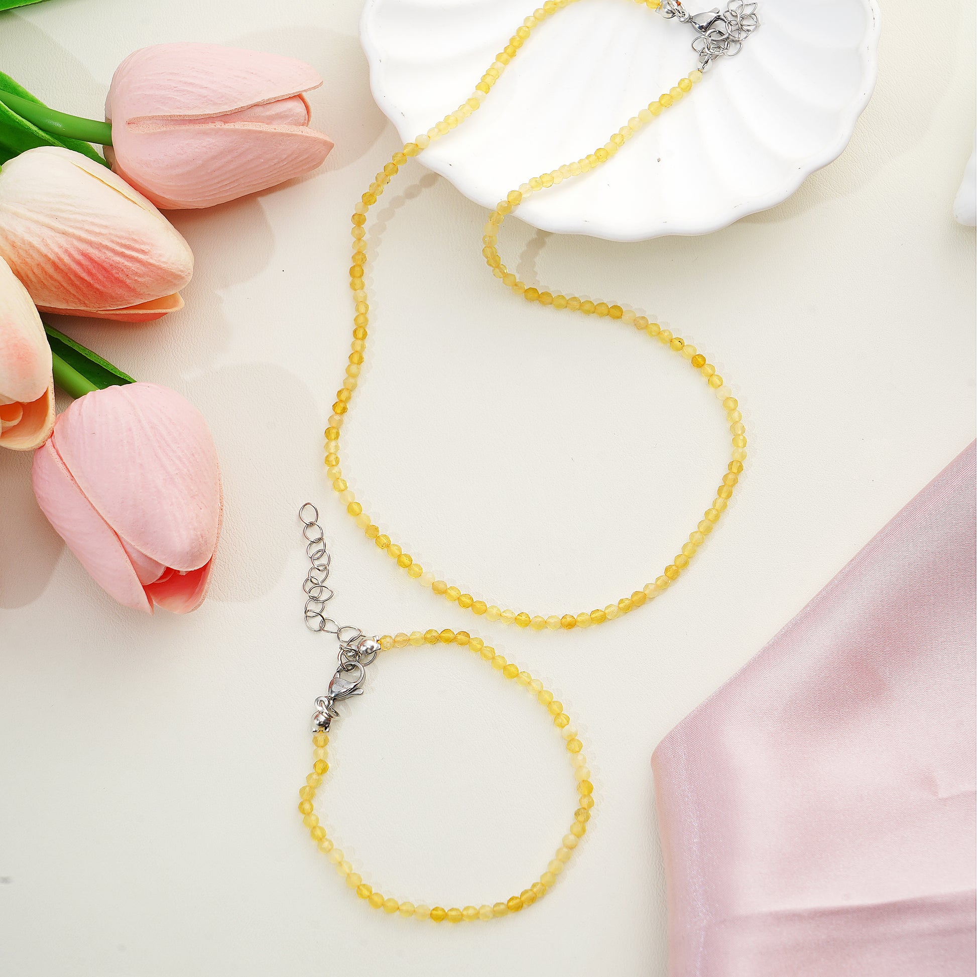 Yellow beaded necklace and bracelet with silver clasp
