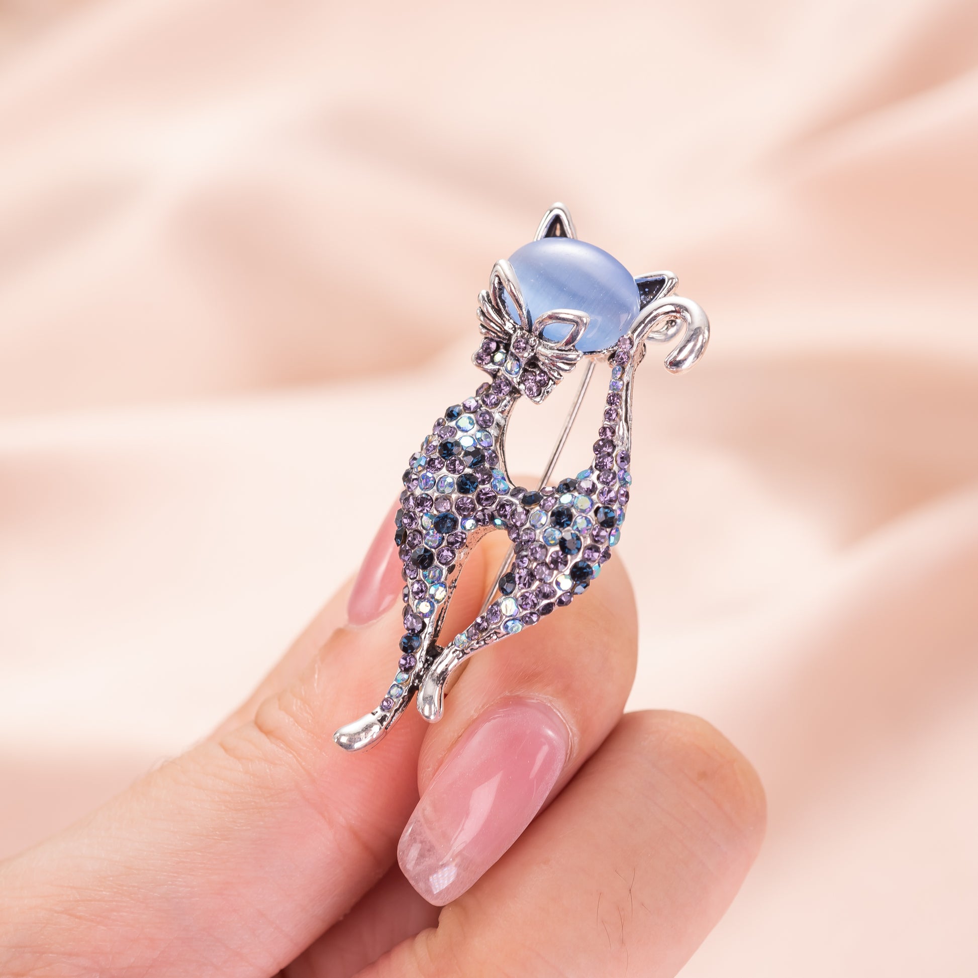 blue cat's eye cat brooch pin with silver-tone metal finish