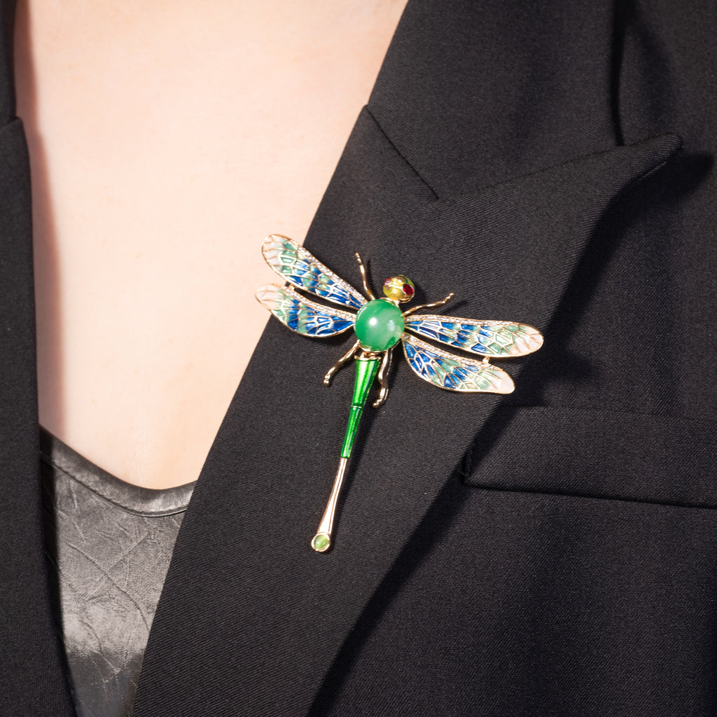 dragonfly enameled brooch pin with vibrant wings and a sparkling crystal center stone