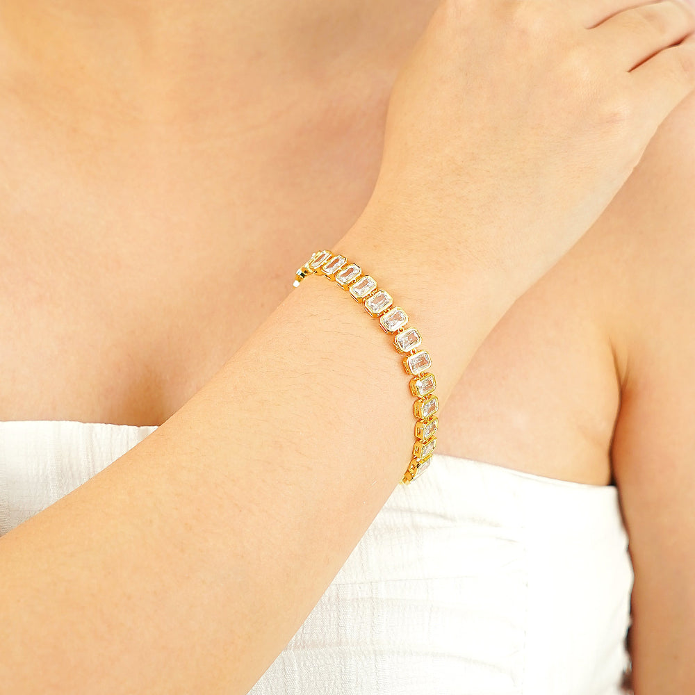 emerald-cut bezel-set simulated diamond tennis bracelet in yellow gold plating