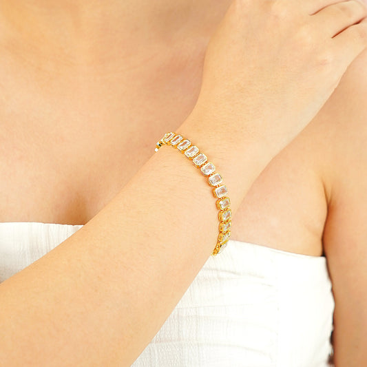 emerald-cut bezel-set simulated diamond tennis bracelet in yellow gold plating