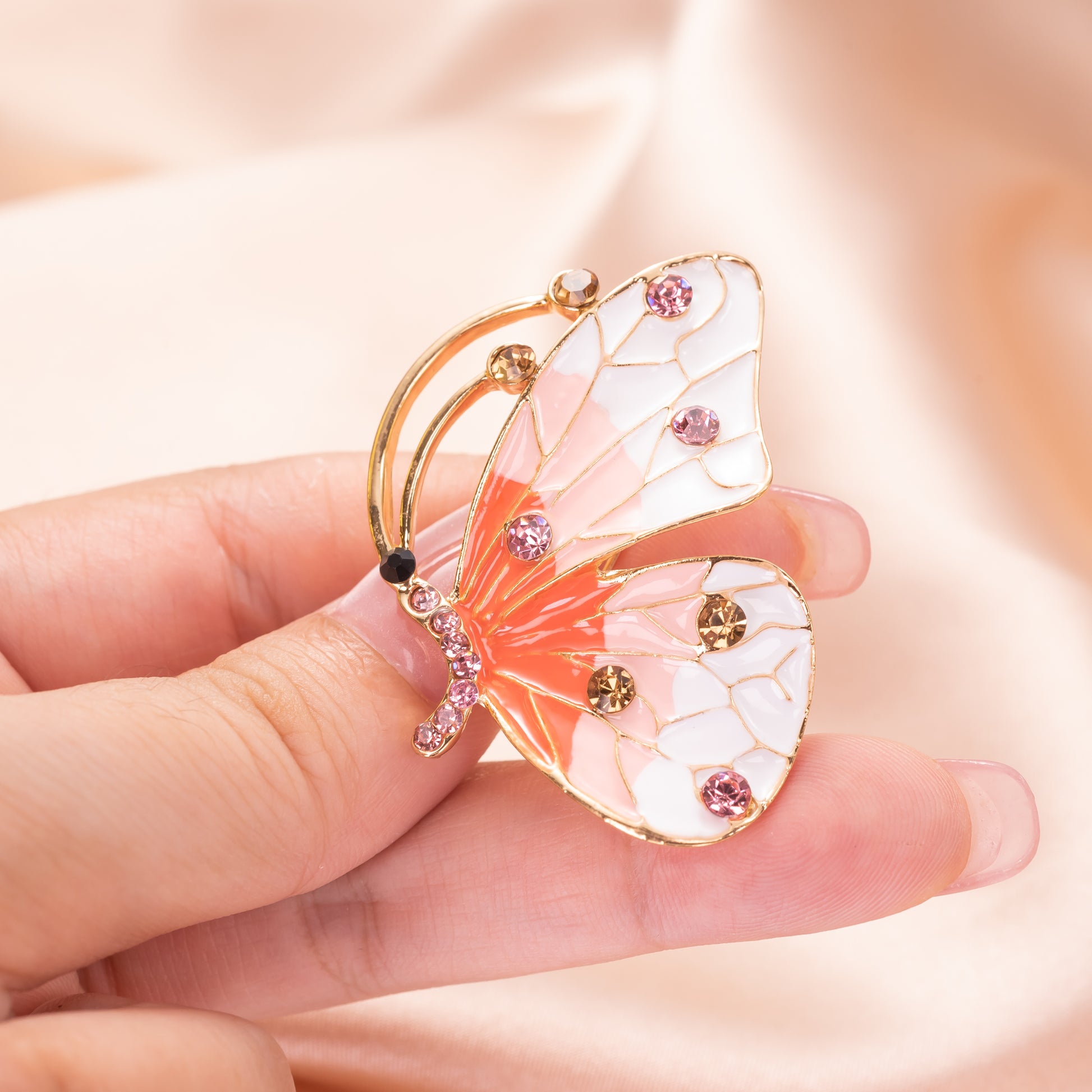 glossy colorful enamel wings on an antique-style butterfly pin