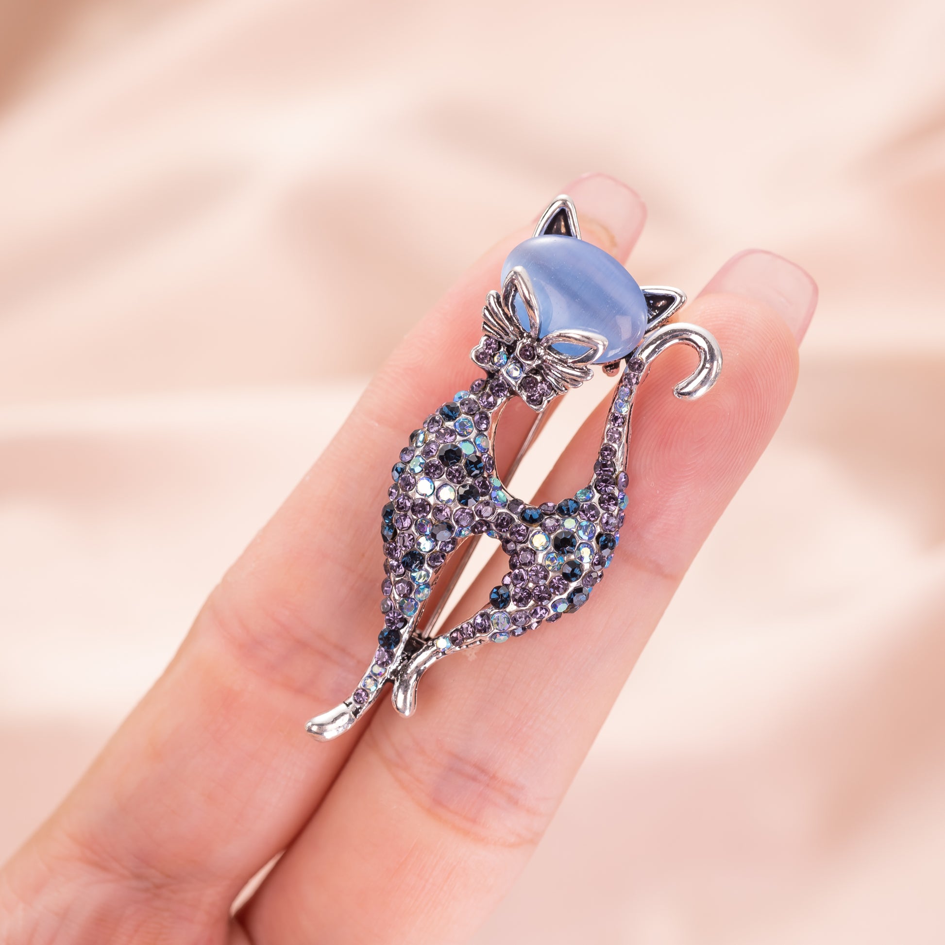 blue cat's eye cat brooch pin with silver-tone metal finish