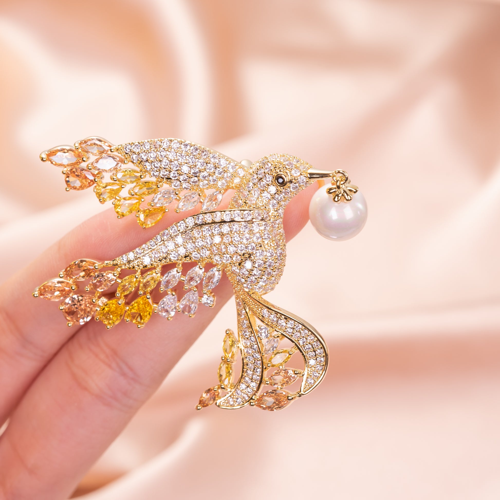 gold dove brooch pinned to a navy blue blazer lapel