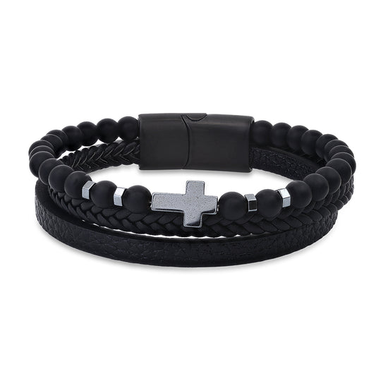 A men's layered black leather bracelet with black lava beads, a hematite cross, and a magnetic clasp.