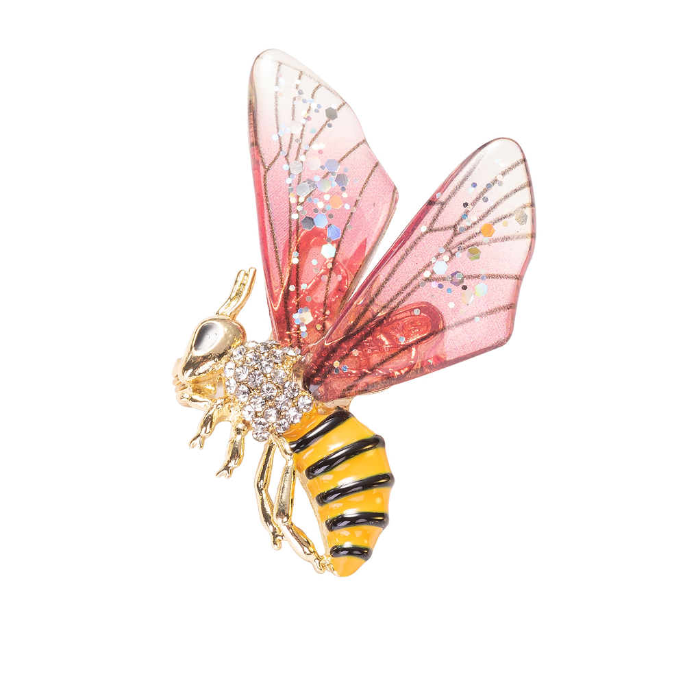 A pin brooch featuring a vibrant pink enamel bee with gold accents and sparkling details.