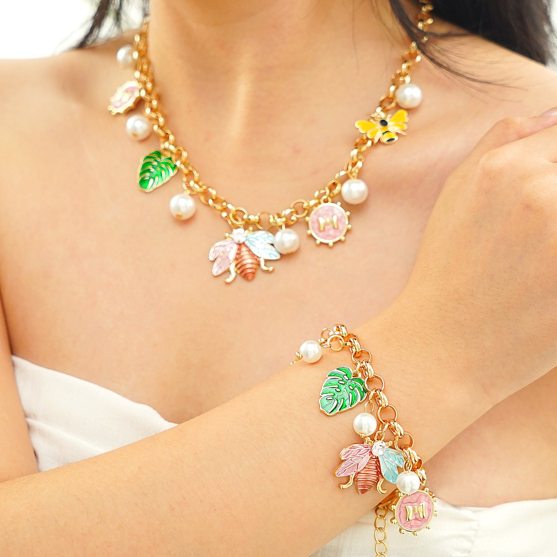 spring nature inspired charm necklace and bracelet set in yellow gold plated brass