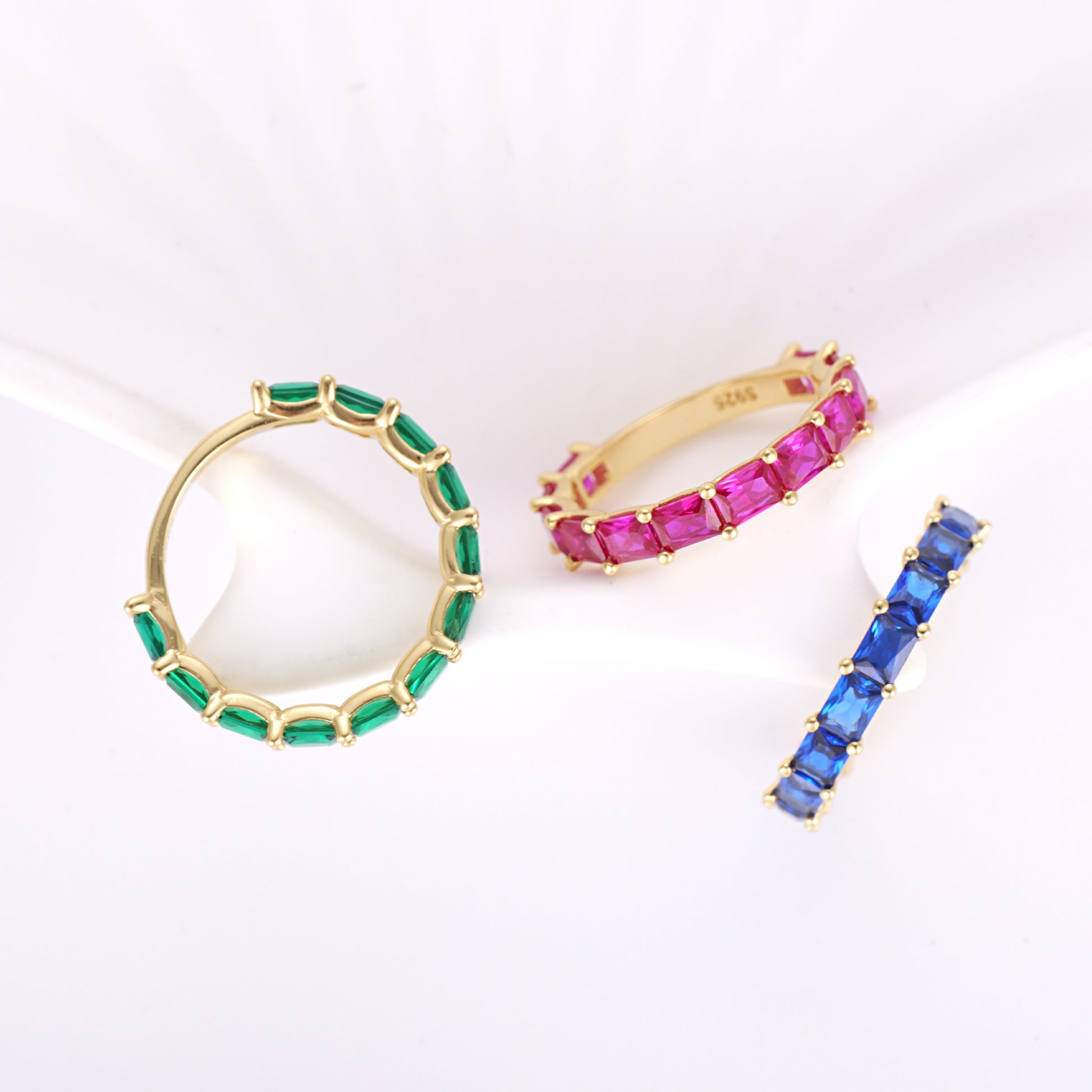 the geometric octagon cut red stones set in a yellow gold vermeil band