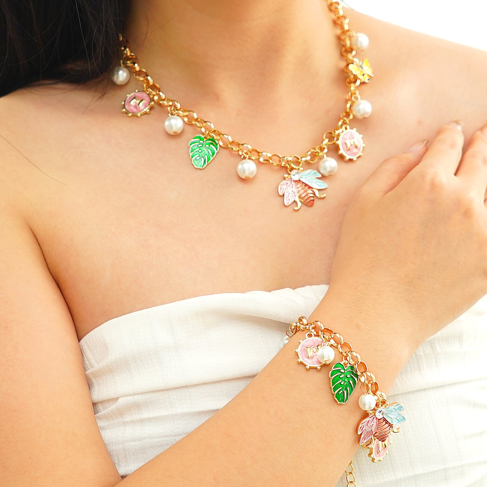 spring nature inspired charm necklace and bracelet set in yellow gold plated brass