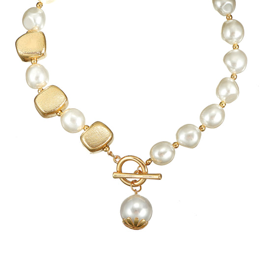 the luminous shell pearl surface and the high-polish 18K gold plating on the toggle lock