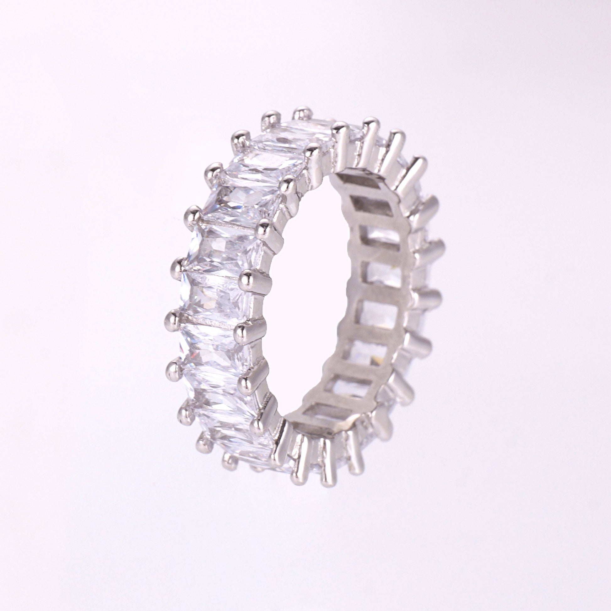 the octagon-cut stones and 925 silver setting on an eternity band ring