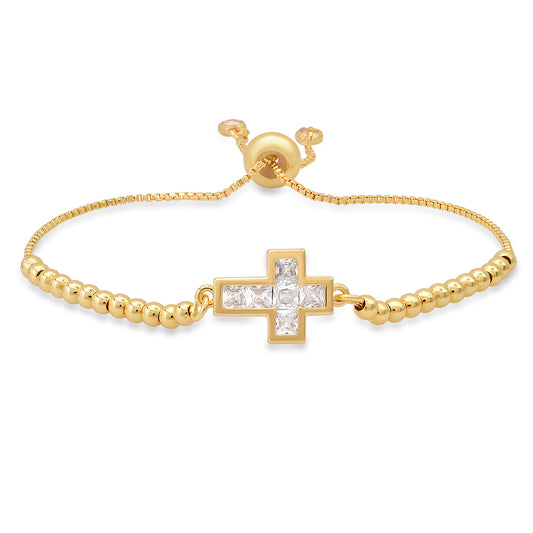 yellow gold plated brass cross bracelet with cubic zirconia stones.